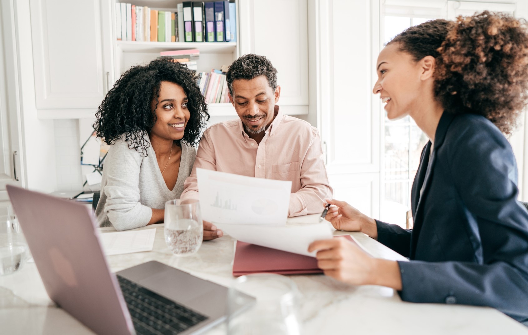 loan origination - couple talking with loan officer